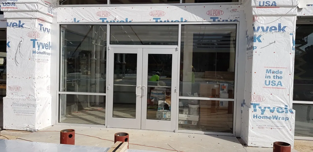 Double glass entrance doors with aluminum storefront framing