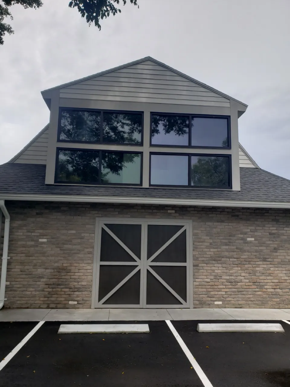 Dark-framed window installation on a South Florida residence