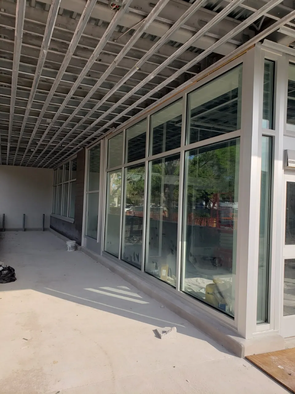 Floor-to-ceiling commercial window wall and glass door installation