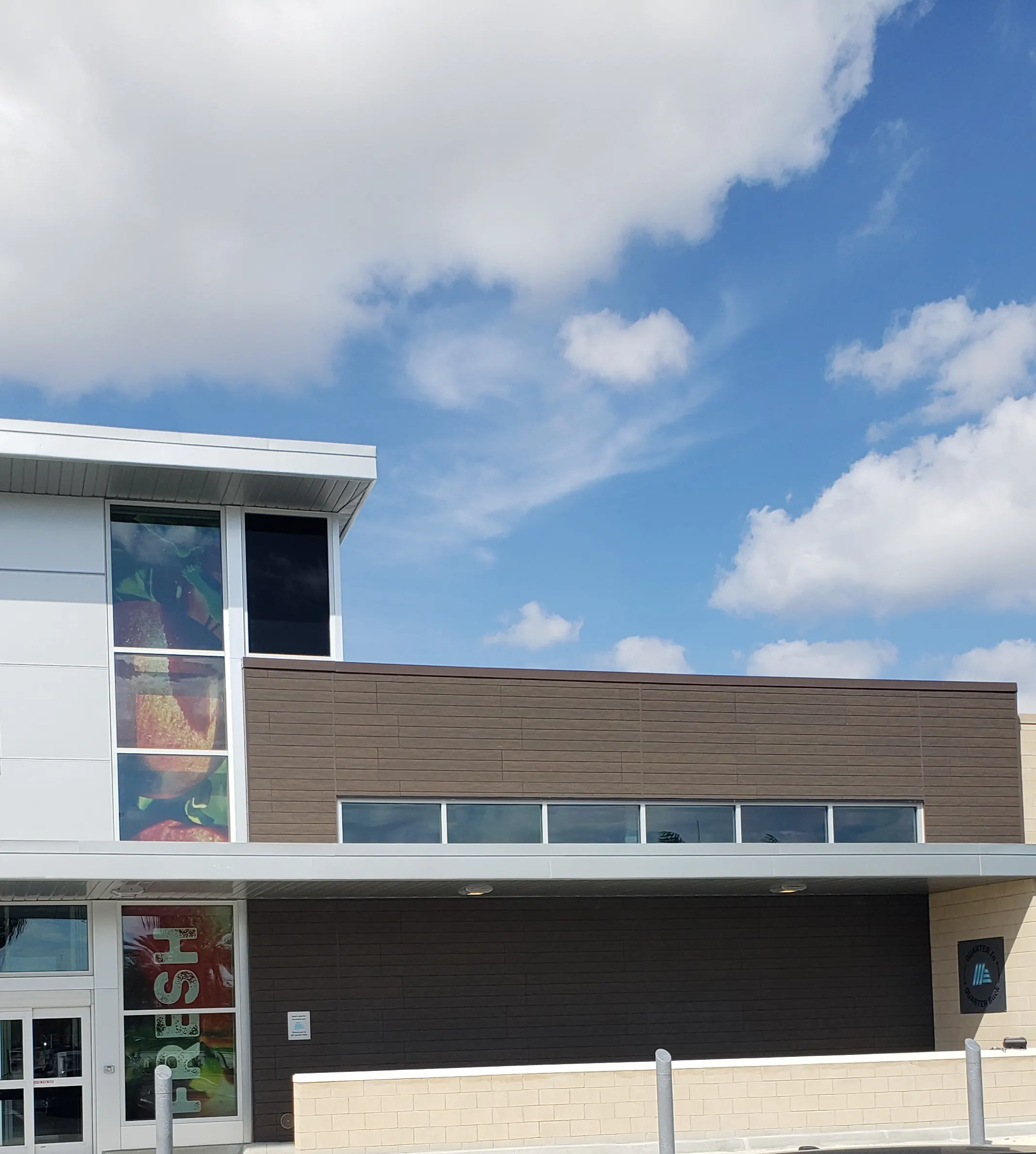 Upper and lower commercial window bands on a finished building